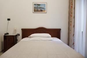 Postel nebo postele na pokoji v ubytování Albergo Italia