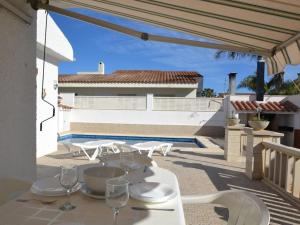 a white table with wine glasses on a patio at Camins 2 in Riumar
