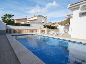 a swimming pool in front of a house at Camins 2 in Riumar