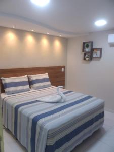 Cama ou camas em um quarto em Pousada Beija Flor