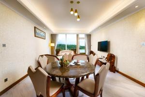 a dining room with a table and chairs at Araliya Beach Resort & Spa Unawatuna- Where you meet the sea all year in Unawatuna