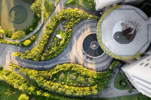 an overhead view of a building with a flower garden at Araliya Beach Resort & Spa Unawatuna- Where you meet the sea all year in Unawatuna
