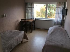 Postel nebo postele na pokoji v ubytování Leo Hotelli
