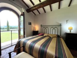Postel nebo postele na pokoji v ubytování Agriturismo LeGi Toscana