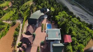 an overhead view of a house with a swimming pool at Vaio Resort in Keda in Vaio