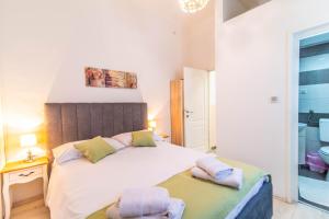 Postel nebo postele na pokoji v ubytování Giovanna Boutique Rooms & Pool