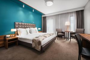 Posteľ alebo postele v izbe v ubytovaní Holiday Inn Krakow City Centre by IHG + 37 fotografií