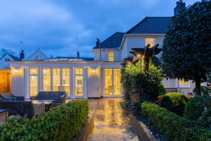a large white house with a lot of windows at St Martin's House in Chichester