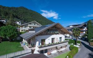 an aerial view of a house with a mountain at Residence Mignon in Rifiano