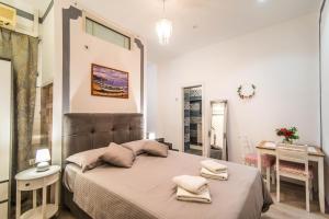 Postel nebo postele na pokoji v ubytování Giovanna Boutique Rooms & Pool