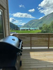 a grill on a deck with mountains in the background at Loen Panorama in Stryn
