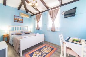 Postel nebo postele na pokoji v ubytování Giovanna Boutique Rooms & Pool