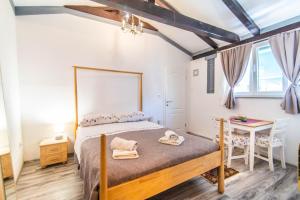 Postel nebo postele na pokoji v ubytování Giovanna Boutique Rooms & Pool