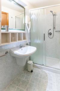 Koupelna v ubytování Hotel Corallo