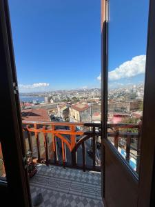 a view of a city from a balcony at En el corazon del Cerro Alegre in Valparaíso