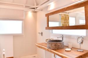 a bathroom with a sink and a window at Exceptional villa with pool and spa, Saint-Barthélemy. in Saint Barthelemy