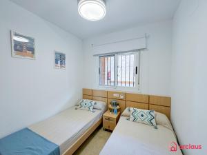 Postel nebo postele na pokoji v ubytování Luz de Mar