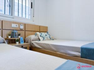 Postel nebo postele na pokoji v ubytování Luz de Mar