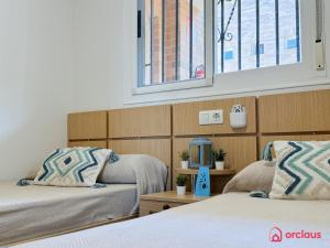 Postel nebo postele na pokoji v ubytování Luz de Mar