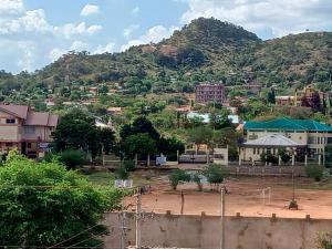 a view of a town with a mountain at Oasis Hotel and Guest House. Voi in Voi