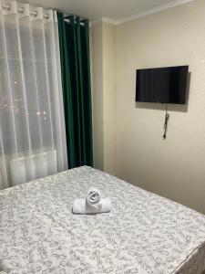 Una cama o camas en una habitación de Нарэл