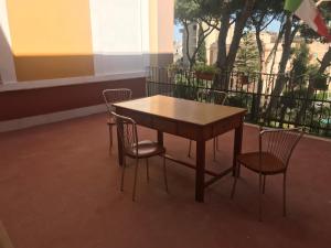 a wooden table and chairs in a room at Villa San Giuseppe Brindisi in Brindisi