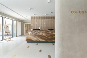 a large room with a large bed in the middle at Rezydencja Merwede Aparthotel - My Rest in Gdańsk