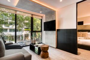 En eller flere senge i et værelse på ULIV Park Polanco + 14 billeder