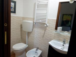 a bathroom with a toilet and a sink at B&B Le Buche Casa Storica in Canino +20 photos