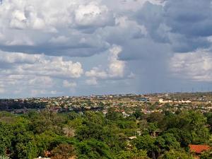a view of a city under a cloudy sky at Oasis Hotel and Guest House. Voi in Voi