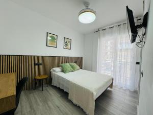 Voodi või voodid majutusasutuse Habitacion Malaga toas