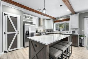 a kitchen with a large island in the middle at Sterling Serenity in Austin