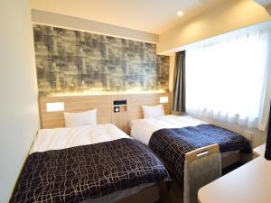 Krevet ili kreveti u jedinici u okviru objekta APA Hotel Kyoto Gojo Omiya