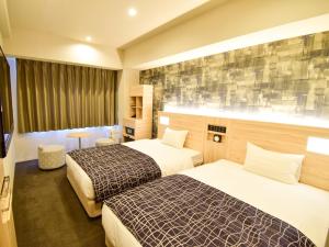 Krevet ili kreveti u jedinici u okviru objekta APA Hotel Kyoto Gojo Omiya