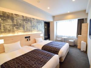 Krevet ili kreveti u jedinici u okviru objekta APA Hotel Kyoto Gojo Omiya