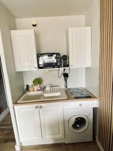 Cuisine ou kitchenette dans l'établissement Sète-Vue mer-#monabridelaplage
