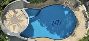 an overhead view of a large blue swimming pool at Patong tower 2bedroom 2 bathrooms, corner view in Patong Beach