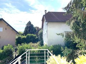 a white house with a fence in front of it at Studio CHIAPELLA in Chambéry