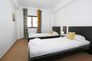 Postel nebo postele na pokoji v ubytování Quinta Amparo Holiday Apartment