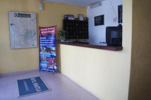 a coffee shop with a counter and a map on the wall at Hotel Huautla de Oaxaca in Oaxaca City