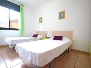 En eller flere senge i et værelse på Flamingo + 19 billeder