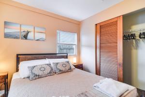 a bedroom with a bed and a window at Cozy St Pete Home about 2 Mi to Madeira Beach! in Redington Shores