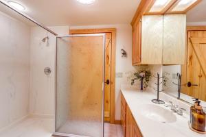 a bathroom with a shower and a sink at Rogers Cabin on 17 Acres with Wraparound Deck! in Rambo Riviera +31 photos