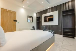 Säng eller sängar i ett rum på OYO Bellevue Apartments Middlesborough