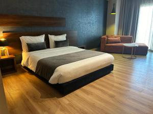 Postel nebo postele na pokoji v ubytování Yto boutique Hotel