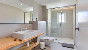 a bathroom with a sink and a toilet and a shower at Apartment Alice in Port de Pollensa +26 photos