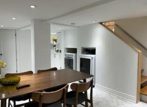 a kitchen with a wooden table and some chairs at Vihome005C1-Beautiful House near Eglinton subway station in Toronto