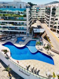 an overhead view of a swimming pool in front of a building at Le Bon Vivant, Nosso Lar in Arraial do Cabo