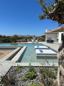 a swimming pool in the middle of a house at Big Blue Villas in Santa Maria