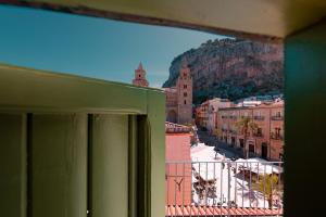 a view of a city from a window at Palazzo Villelmi in Cefalù